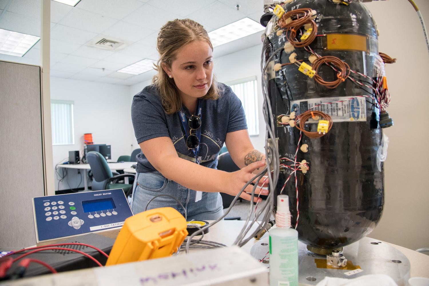 Carthage alumna, Celestine Ananda, works on the MPG experiment during her internship at NASA Kennedy Space Center.